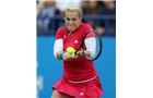 EASTBOURNE, ENGLAND - JUNE 16: Anastasia Pavlyuchenkova of Russia plays a backhand against Agnieszka Radwanska of Poland during their Women's Singles first round match on day three of the Aegon International at Devonshire Park on June 16, 2014 in Eastbourne, England.  (Photo by Steve Bardens/Getty Images)